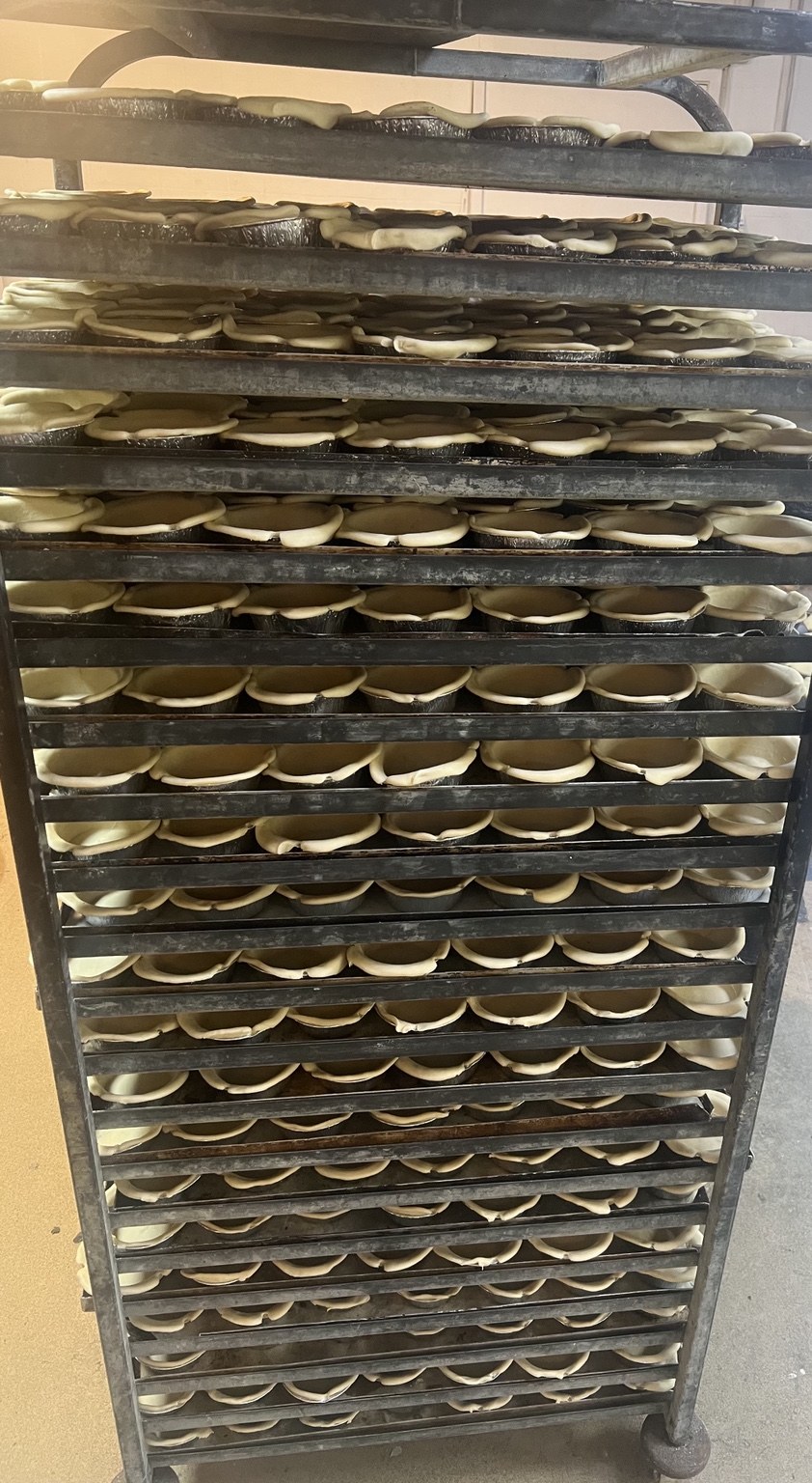 Trays of pies being prepared in the Yorkshire Pie Bakery